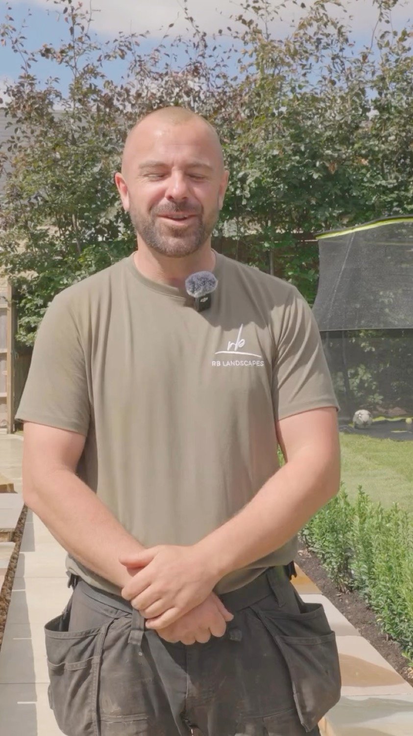 Ross, founder of RB Landscapes, in a finished garden